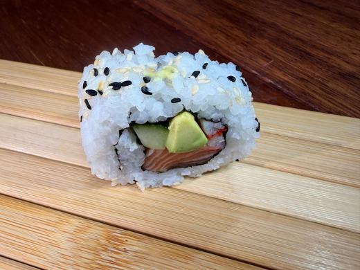 Avocado inside-out roll with sesame