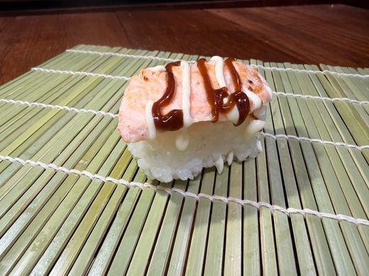 Seared salmon nigiri with drizzle