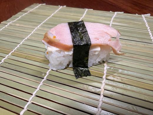 Seared fish nigiri wrapped in nori