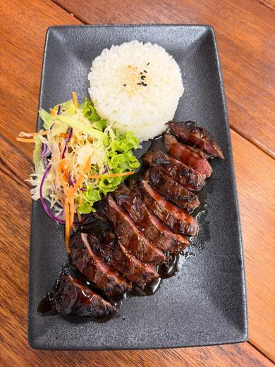 Grilled steak with rice and salad