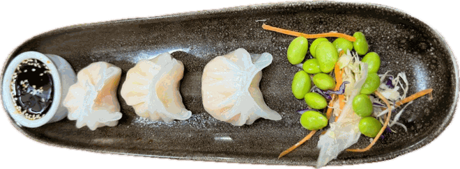 Steamed gyoza dumplings with edamame and dipping sauce