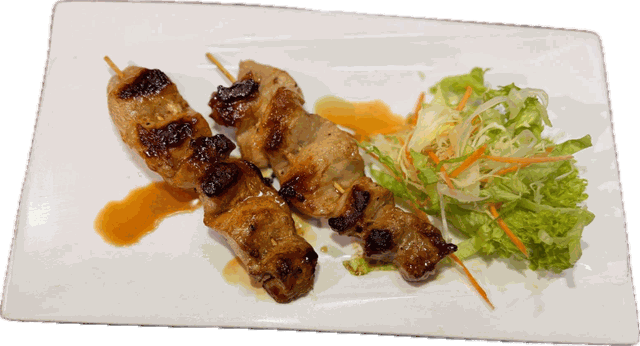 Grilled chicken skewers with salad